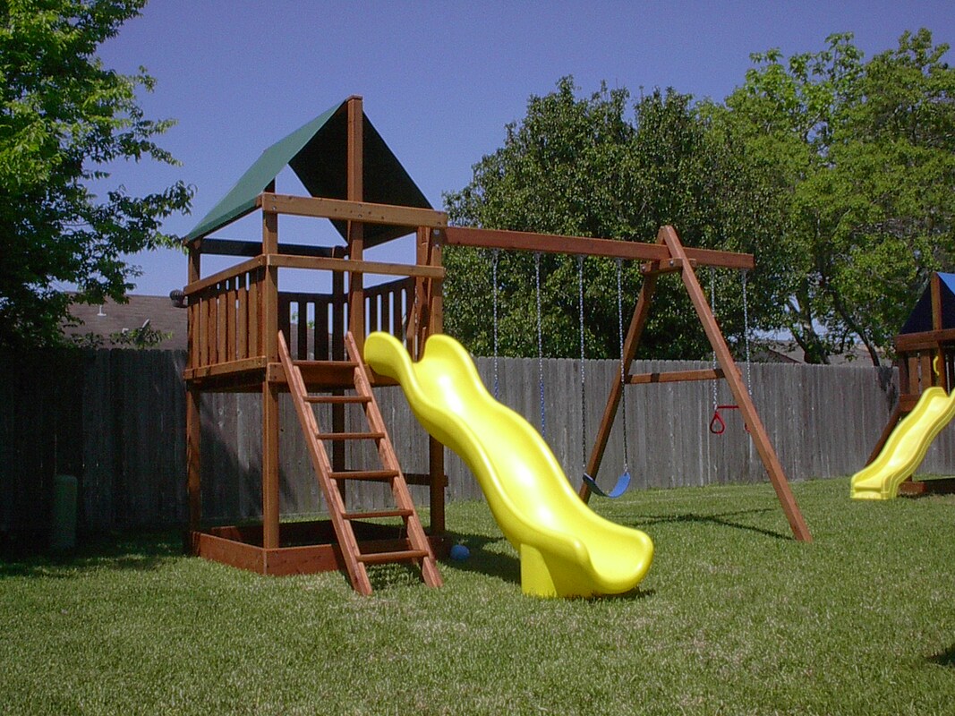 Triton Playset with 10' wave sllide and four position swingset.
